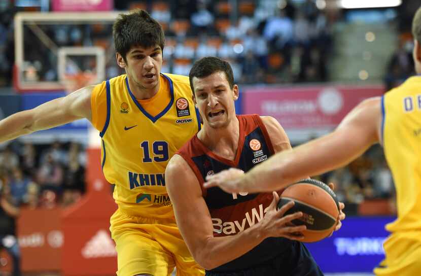 Moscow's Montenegrin forward Marko Todorovic (L) and Bayern Munich's forward Paul Zipser (R)...
