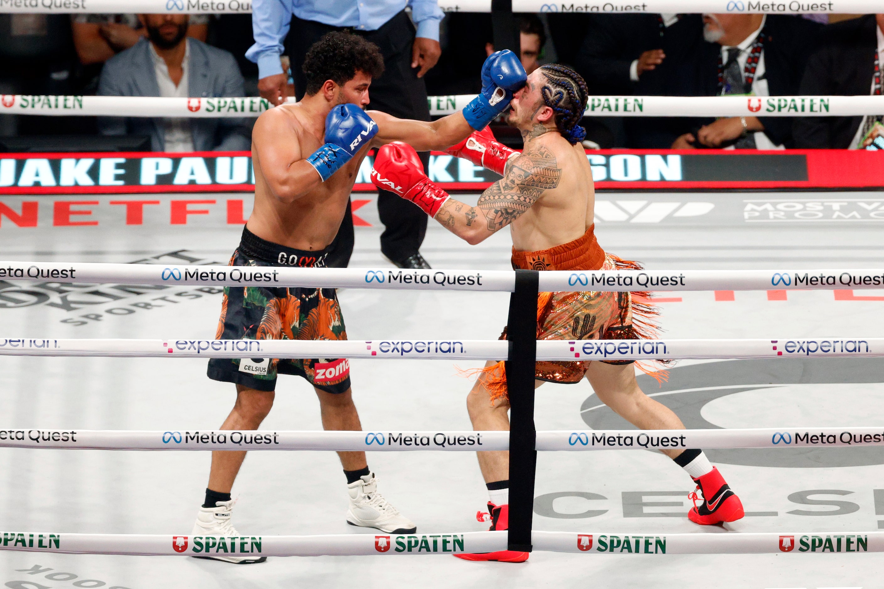 Whindersson Nunes (right) takes a punch from Neeraj Goyat during a super middleweight boxing...