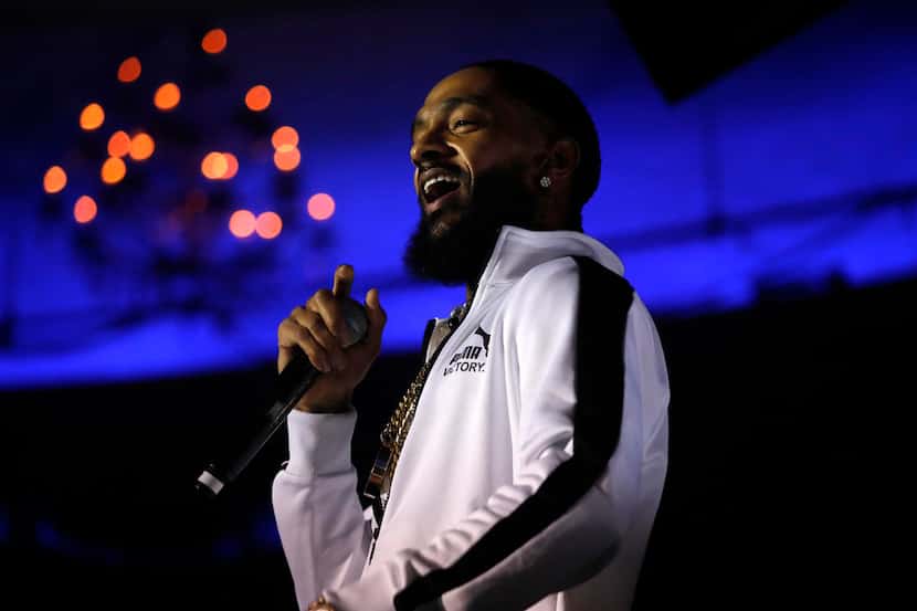 Rapper Nipsey Hussle performs music from his album "Victory Lap," along with other songs, on...