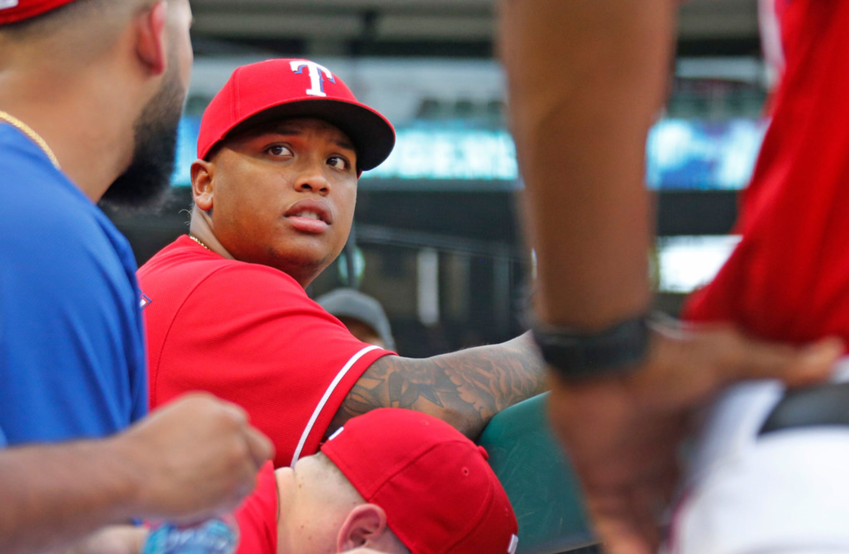 Texas Rangers designated hitter Willie Calhoun (5) is pictured in the dugout before the...