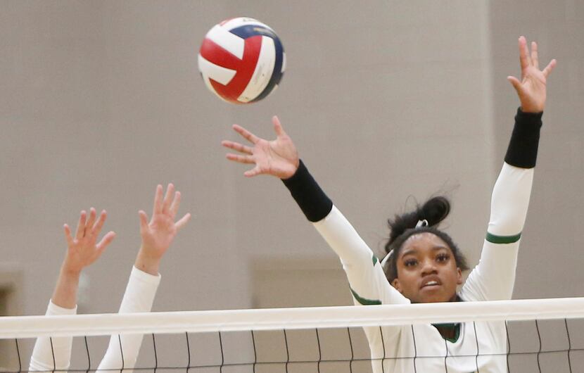 Frisco Lebanon Trail's Tyrah Arial (7) is joined by a teammate as they defend against Frisco...