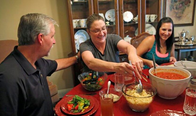 
Kathleen Storm of Red Oak (center) survived her first husband’s murder-suicide attempt in...