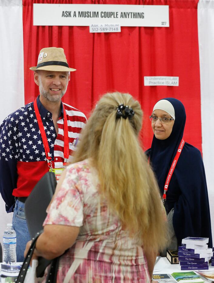 Aicha and Clay Smith staff the "Ask a Muslim Couple Anything" booth in the exhibit hall at...
