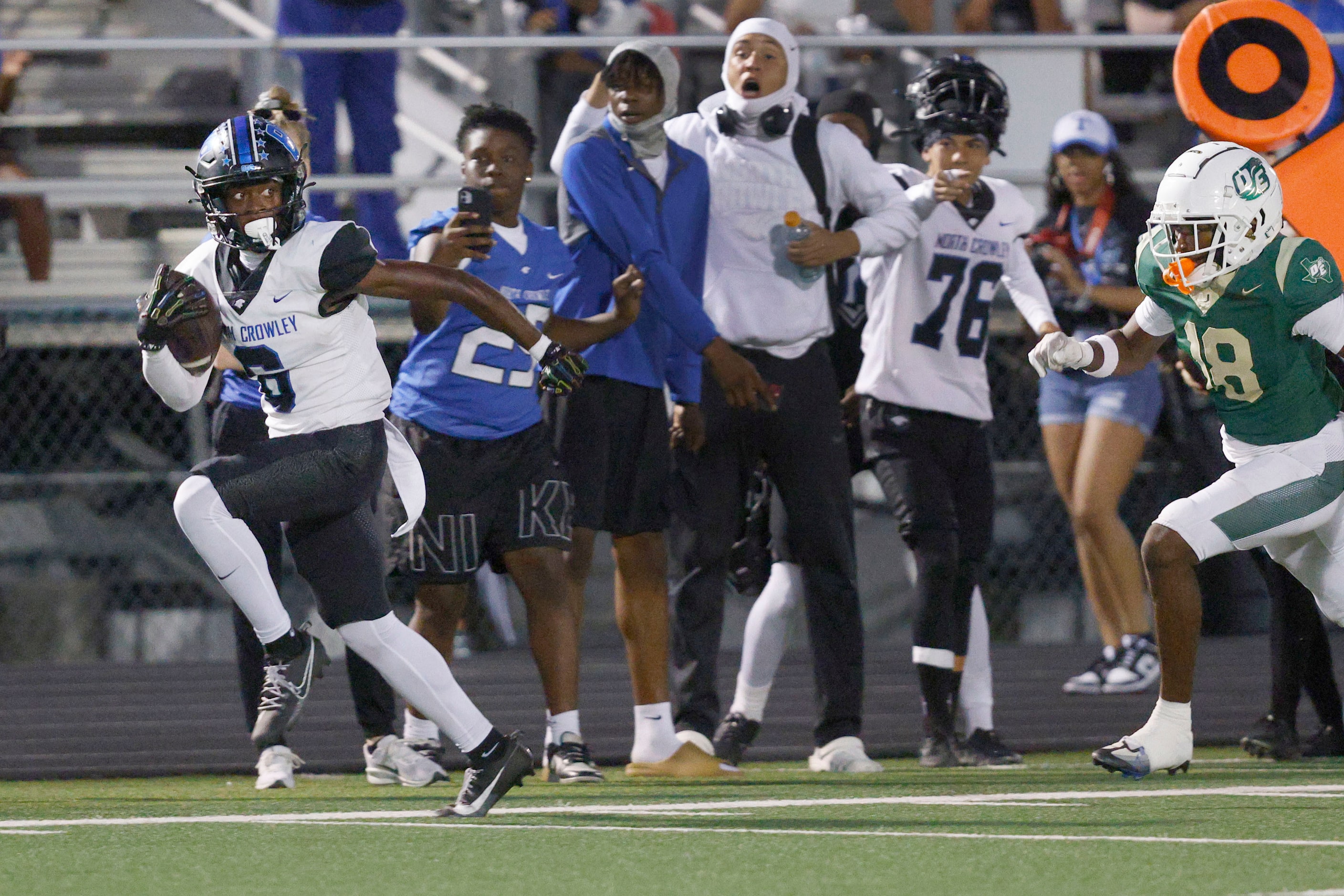 North Crowley's Quentin Gibson runs into the end zone for a touchdown as DeSoto's Ryan Pelly...