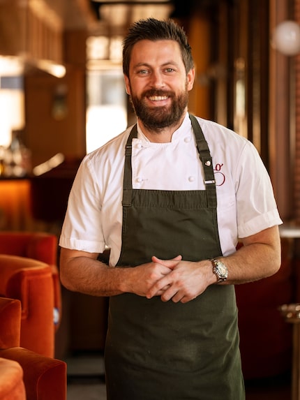 Chef in apron in his restaurant