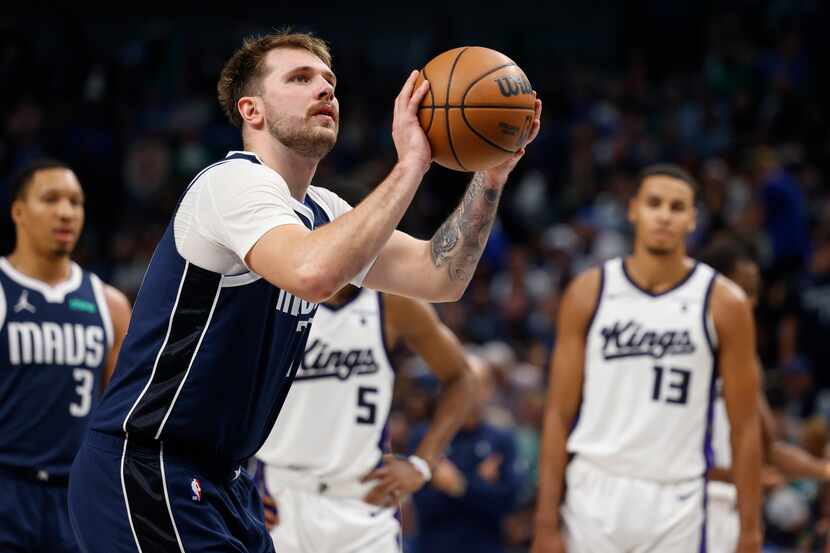 Dallas Mavericks guard Luka Doncic (77) attempts a free throw during the second half of an...
