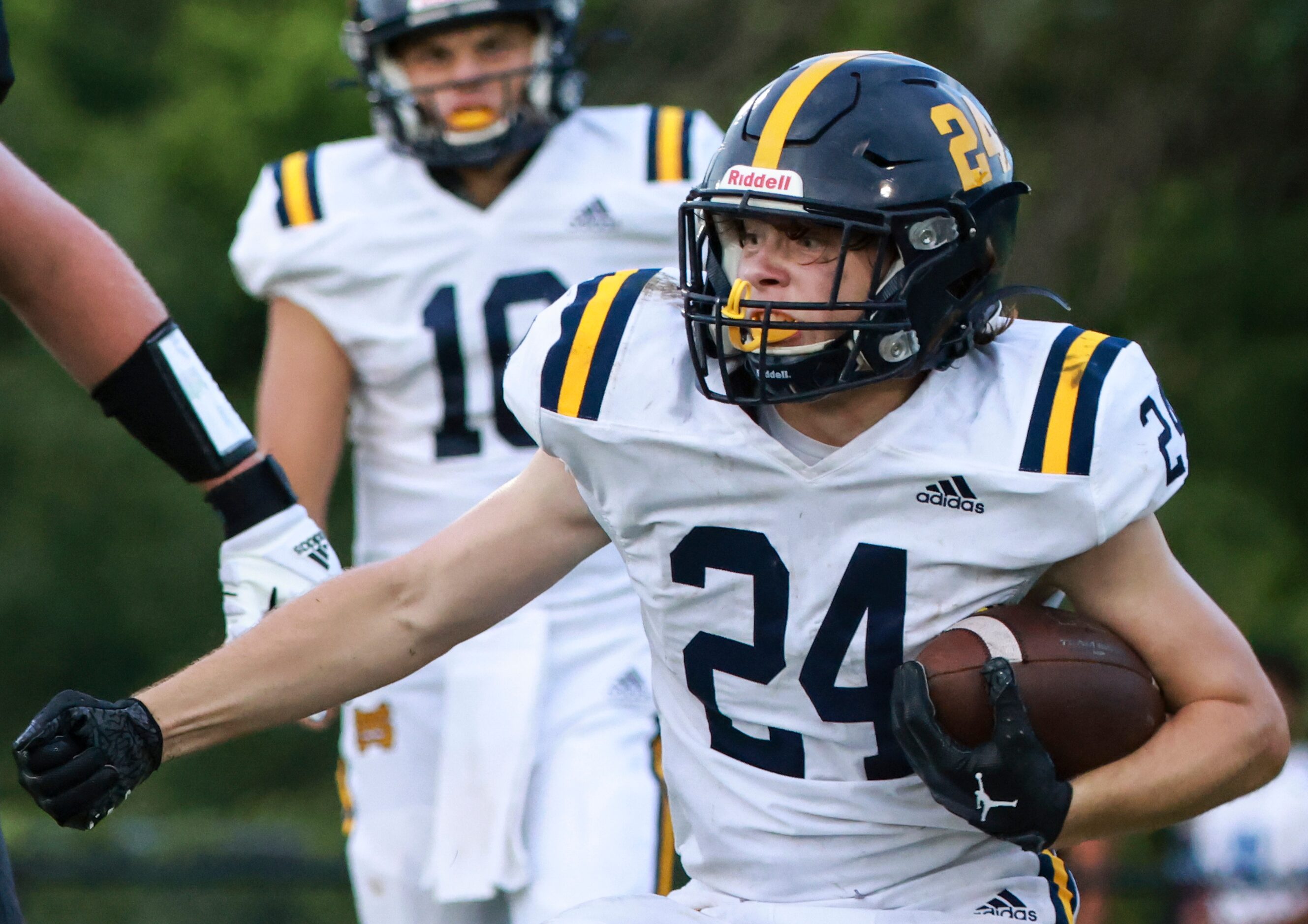 St. Mark's School of Texas Russell Higgins (24) runs the ball up the field during the...