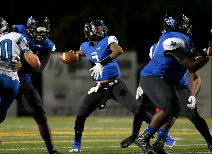 Trinity Christian-Cedar Hill quarterback Shedeur Sanders (2) throws a pass downfield during...