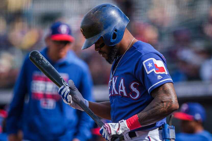 Texas Rangers outfielder Delino DeShields prepares to bat during the first inning a spring...