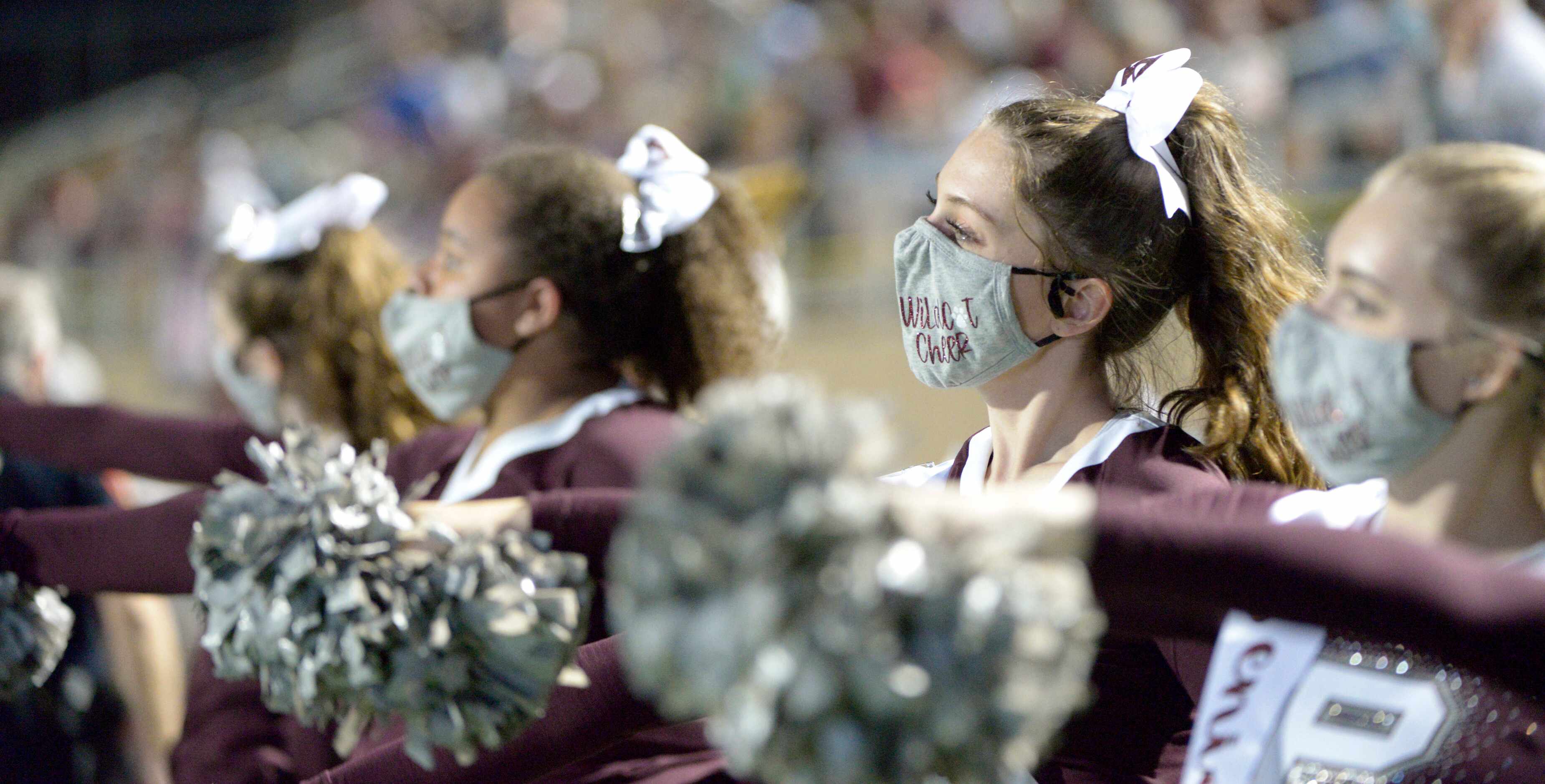 Plano cheerleaders in the first quarter of a high school football game between Lake Highland...