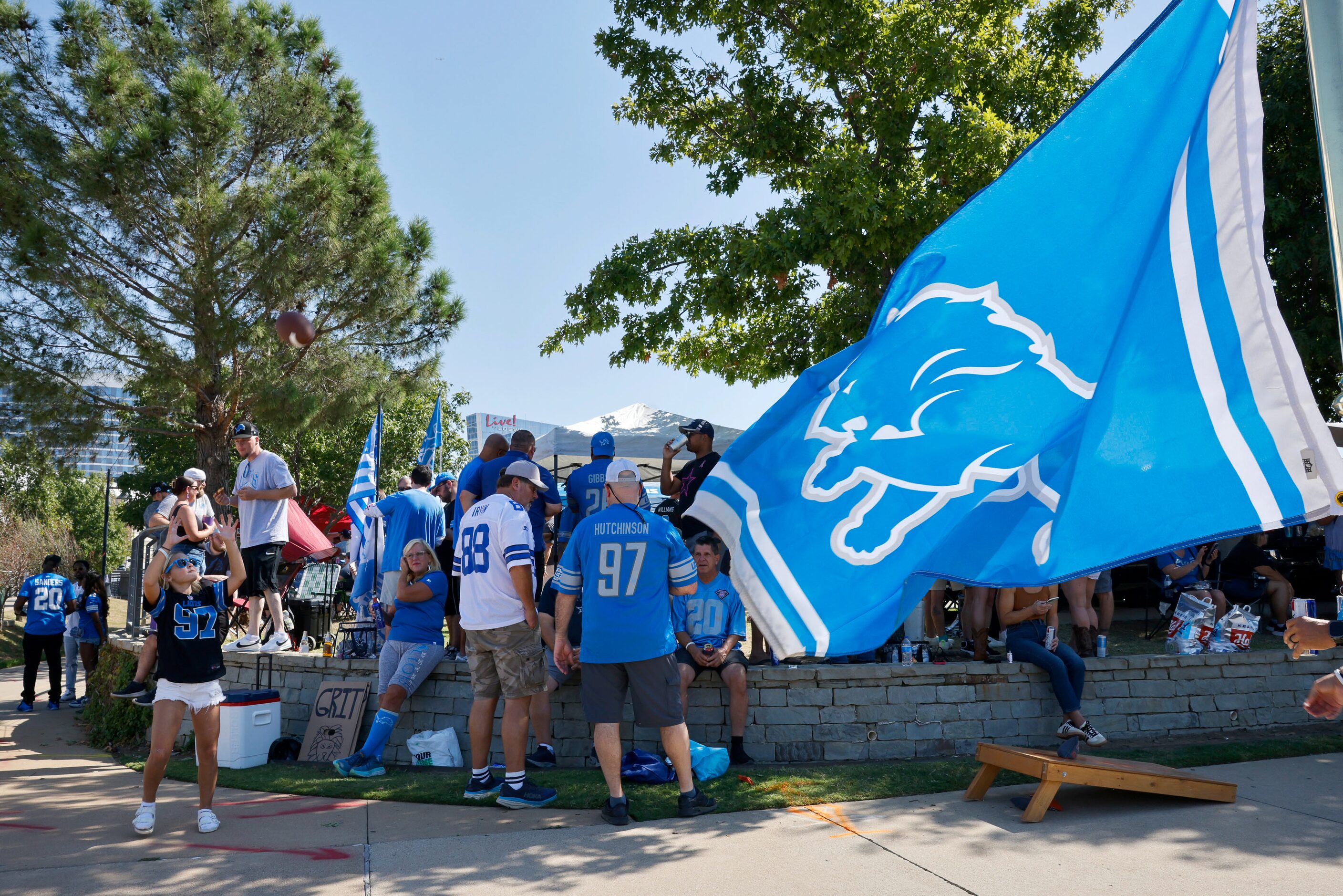 A Detroit Lions’ flag flies as fans spend time tailgating before an NFL football game at...