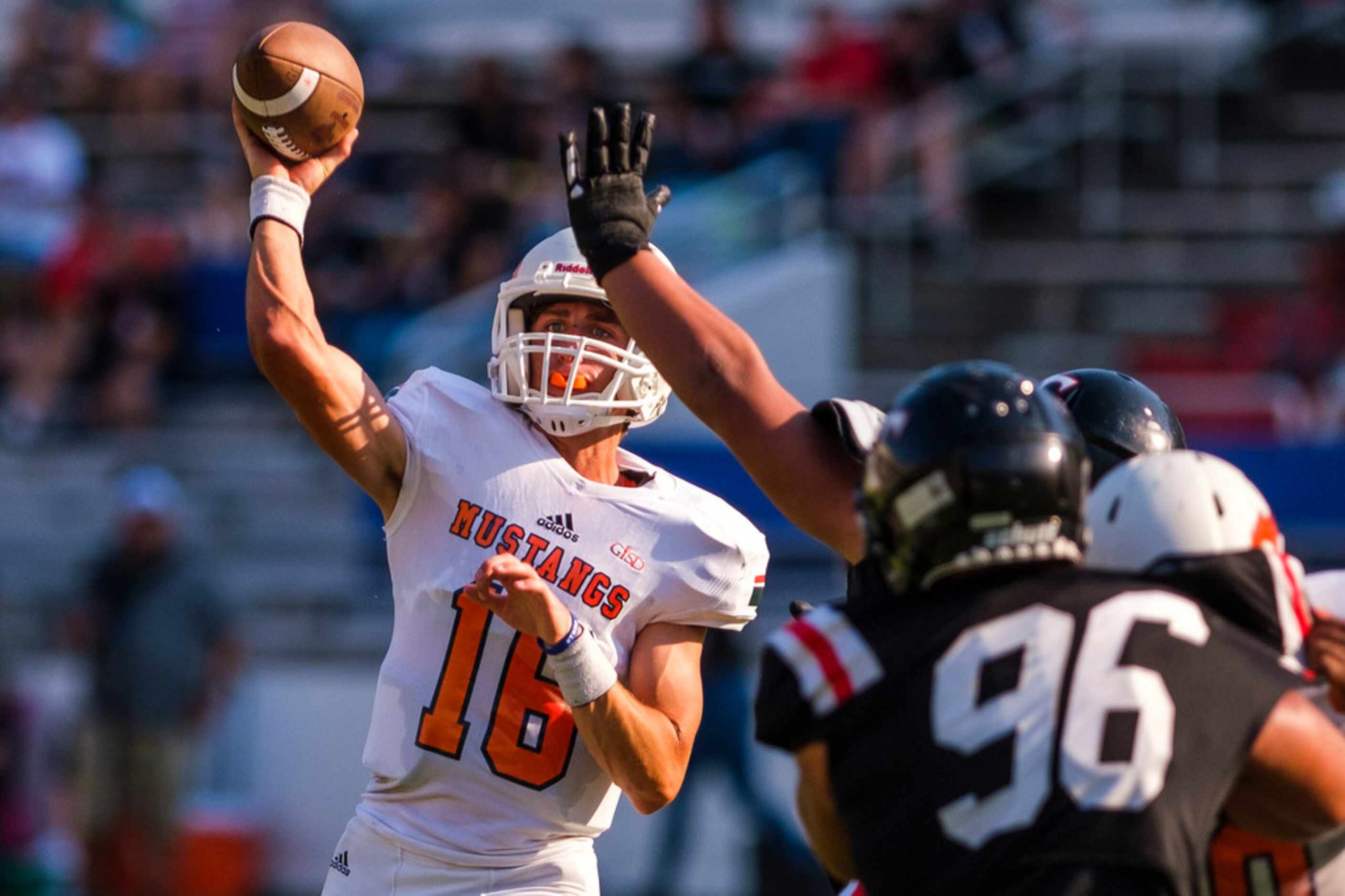 Sachse quarterback Parker Wells (16) throws a pass during the first half of a high school...