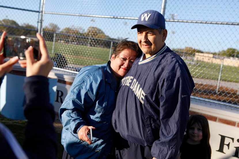 
Diane Casiano (left) hugs her brother, Raymond DeLeon, after a dedication ceremony for...
