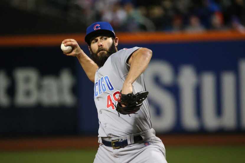 Chicago Cubs starting pitcher Jake Arrieta (49) pitches in the first inning during Game 2 of...