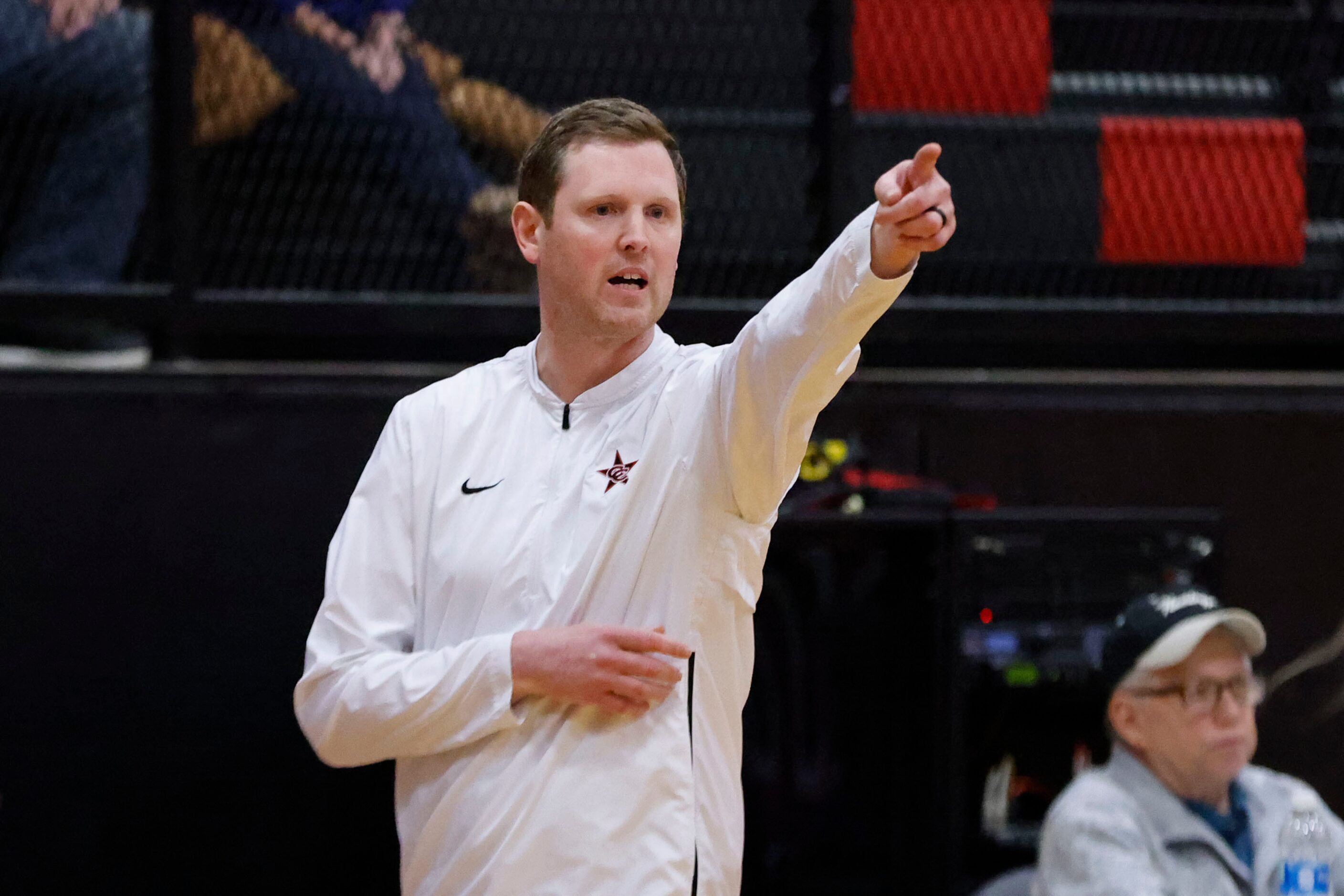 Coppell head coach Ryan Murphy directs his team during the second half of their 7-6A girls...