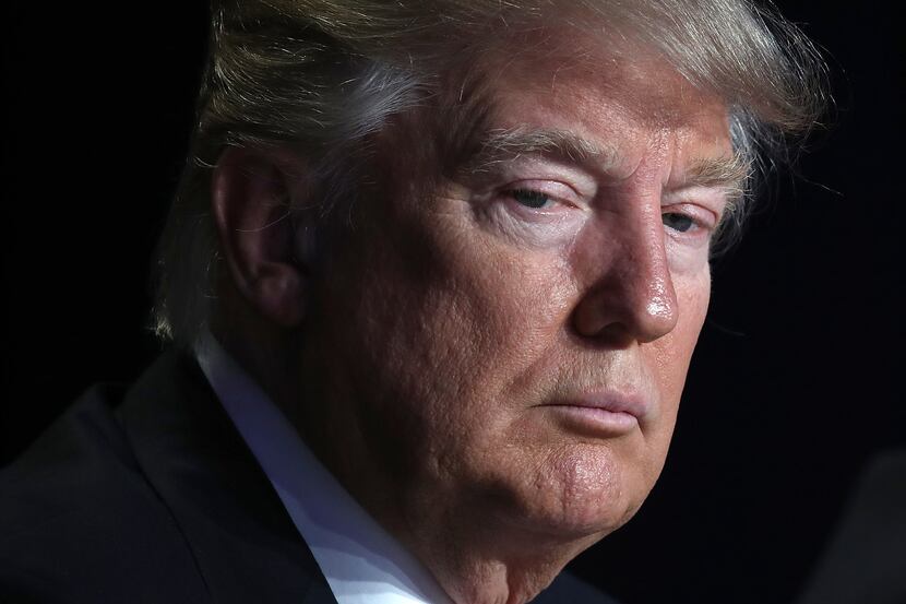 Pres. Donald Trump listens to remarks at the National Prayer Breakfast February 2, 2017 in...