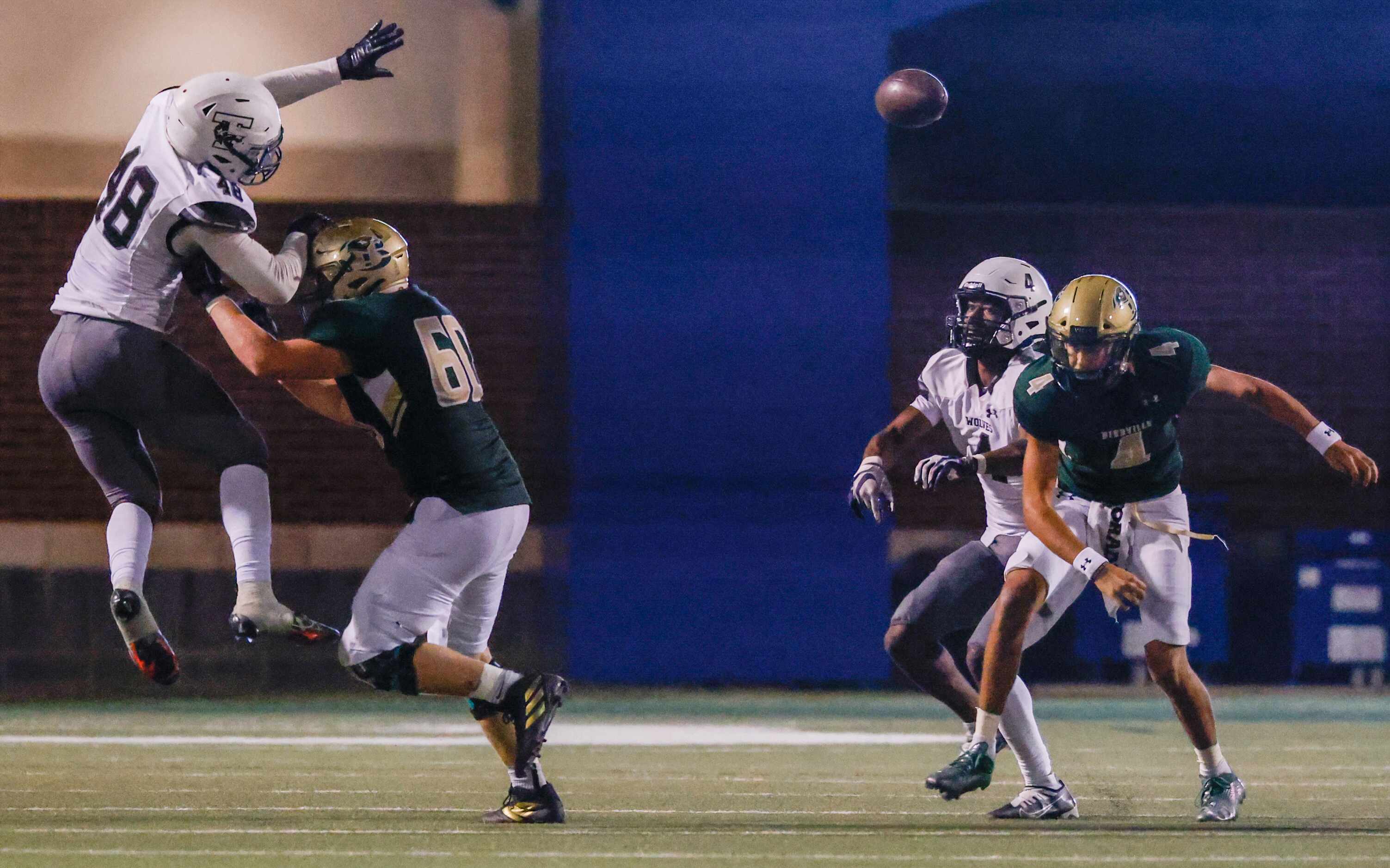 A throw from Birdville quarterback Noah Normand (4) is knocked out of Normand’s hands by...
