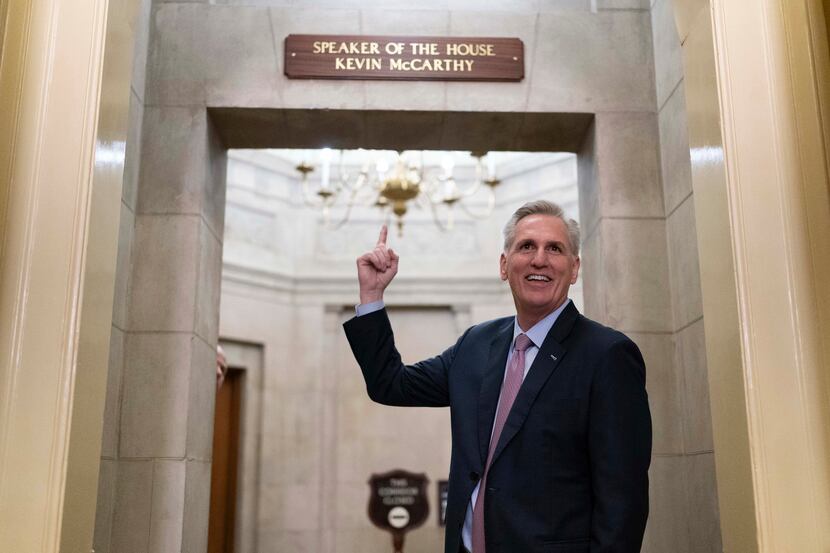 Speaker of the House Kevin McCarthy of Calif., points to the newly installed nameplate at...