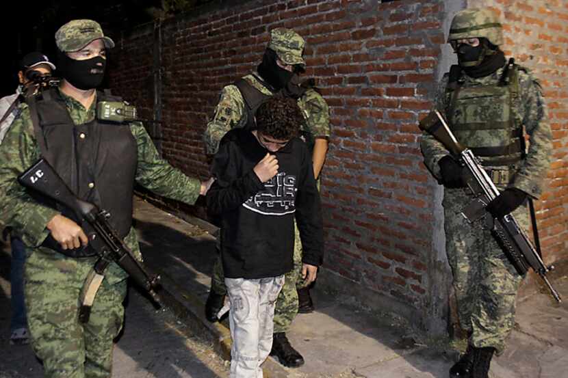 Mexican soldiers present Edgar "El Ponchis" Jimenez Lugo to the media in December 2010 in...