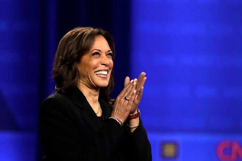 Sen. Kamala Harris, D-Calif., claps as she takes the stage during an October 2019 town hall...