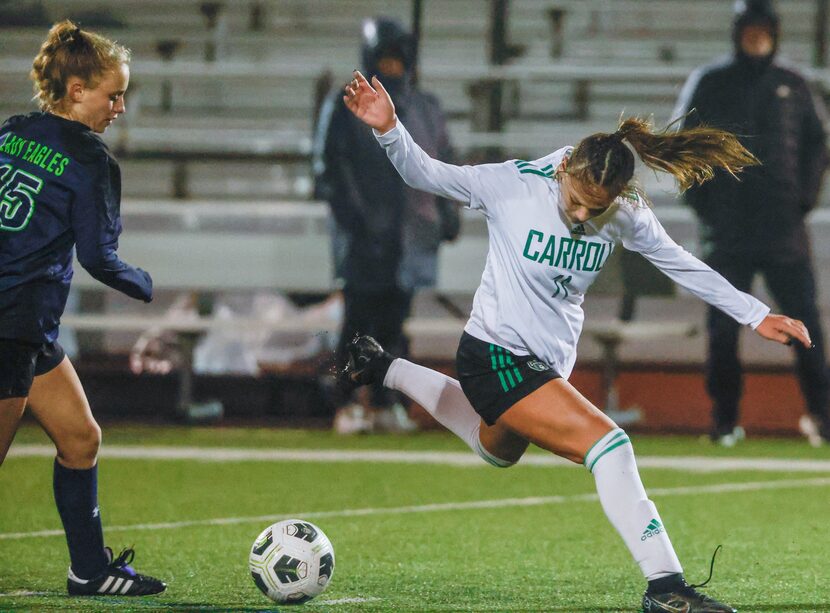 Southlake Carroll High School freshman midfielder Kamdyn Fuller (11) stops and turns to...