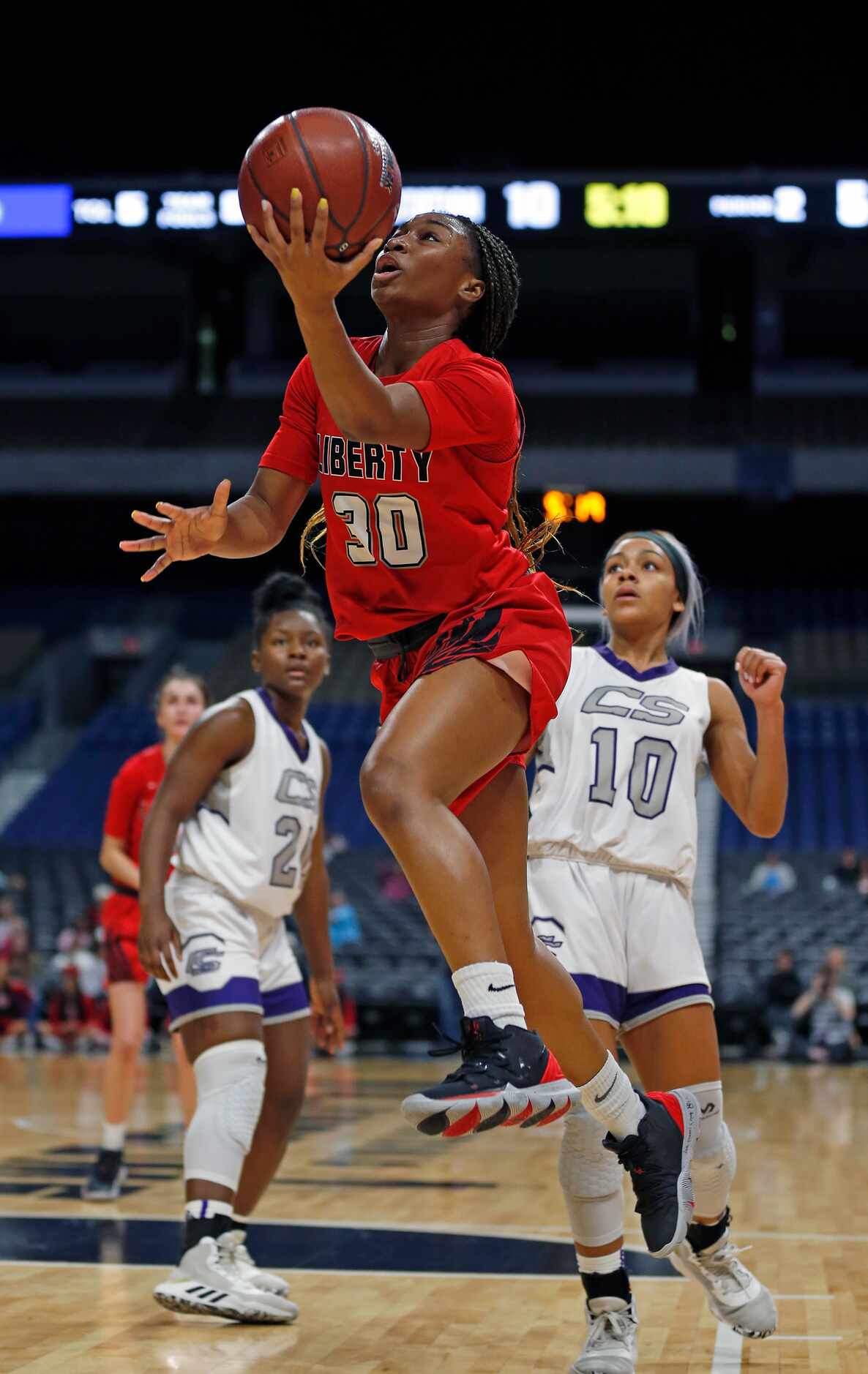 Frisco Liberty sophomore guard Jazzy Owens-Barnett scores against College Station in a 5A...
