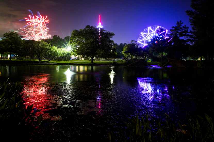 Fireworks light up over the Leonhardt Lagoon during an earlier Fair Park Fourth celebration...