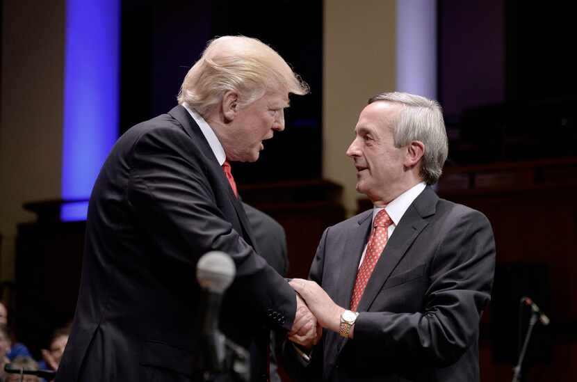 President Donald Trump and First Baptist Dallas Pastor Robert Jeffress (right) participated...