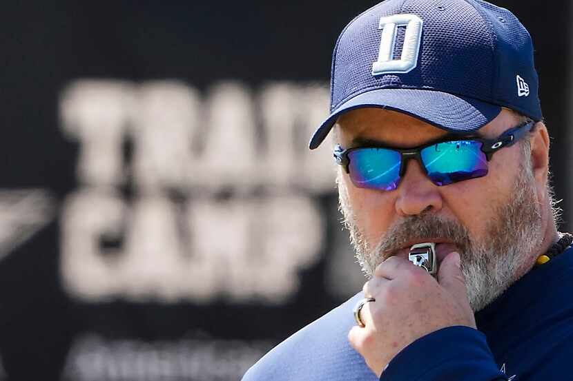 Dallas Cowboys head coach Mike McCarthy blows a whistle during a practice at training camp...