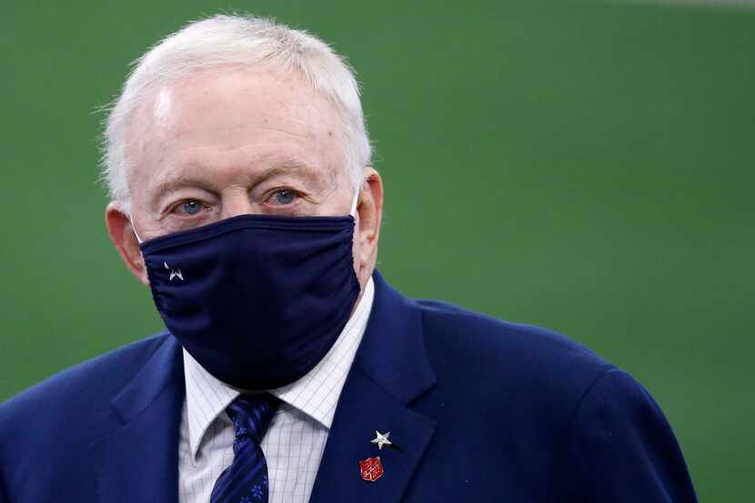 Dallas Cowboys owner and general manager Jerry Jones walks the field during warmups before a...
