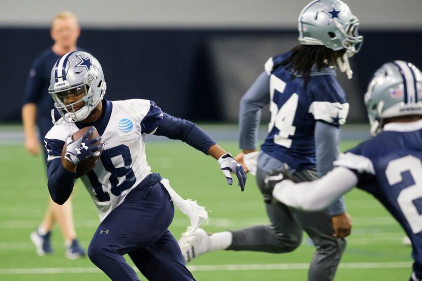 Dallas Cowboys wide receiver Randall Cobb (18) runs after a catch during a team OTA practice...