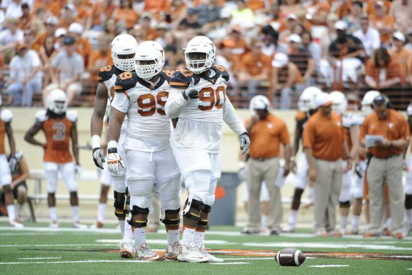 Apr 19, 2014; Austin, TX, USA; Texas Longhorns defensive tackles Malcolm Brown (90) and...