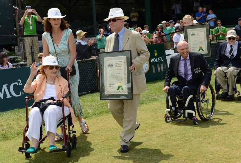 
Nancy Jeffett (left) waves to the crowd at the International Tennis Hall of Fame induction...