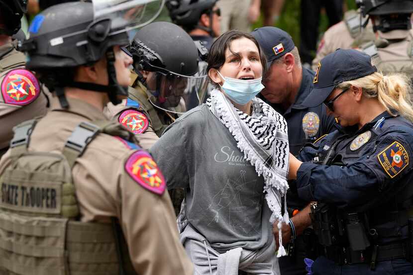 A woman is arrested at a pro-Palestinan protest at the University of Texas, Wednesday, April...