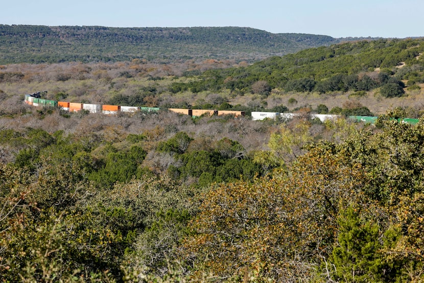 A train passes through the countryside at Palo Pinto Mountains State Park, Tuesday, Nov. 19,...