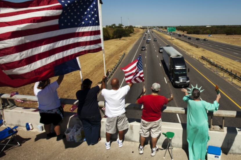 Over a dozen flag-waving patriots -- including (from left) Terrann Wallis, Desiree Wolford...