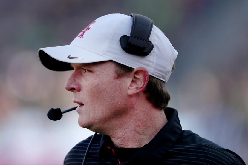 FORT WORTH, TEXAS - DECEMBER 22: Head coach Major Applewhite of the Houston Cougars looks on...