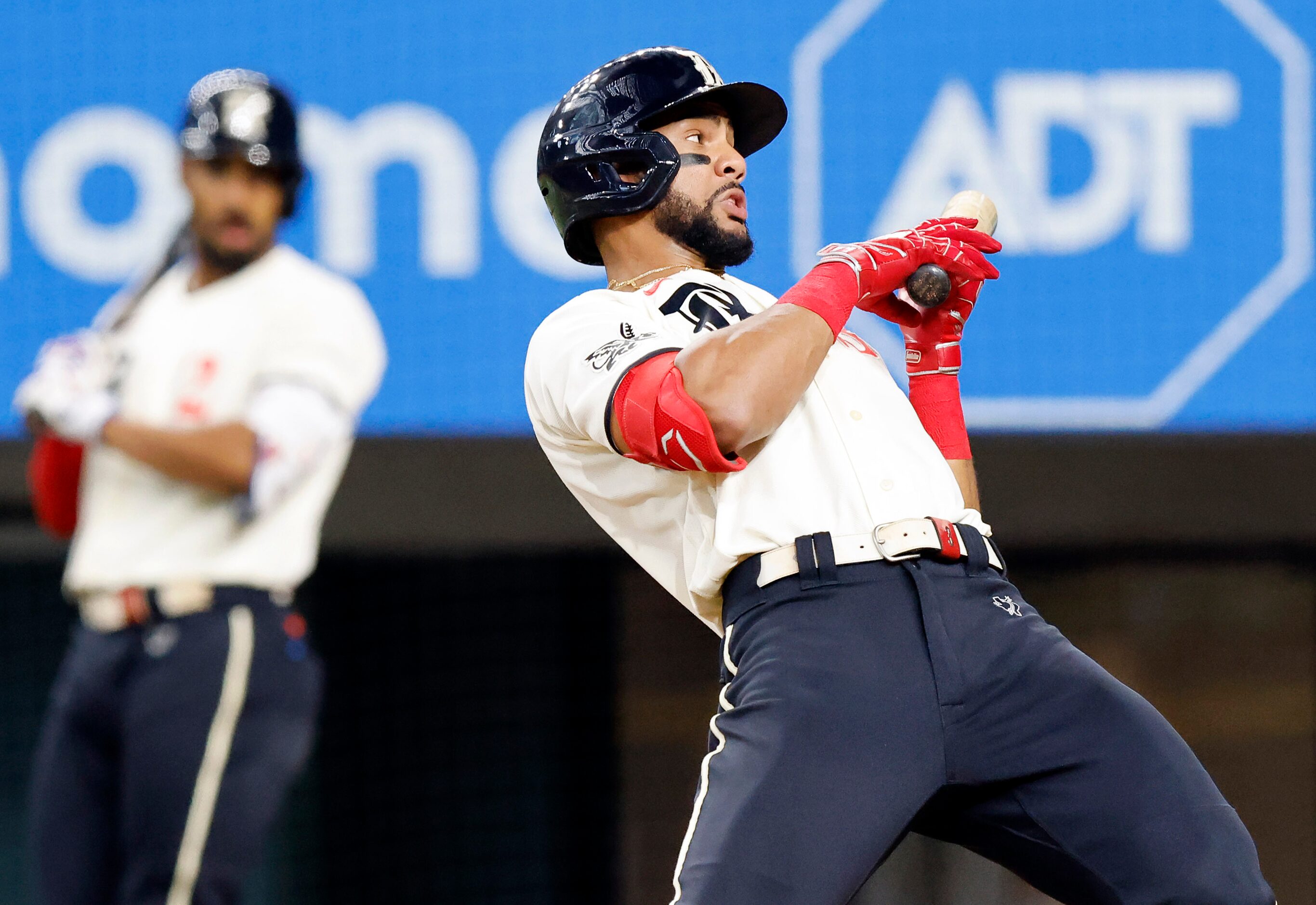 Texas Rangers center fielder Leody Taveras (3) leans back from an inside pitch from the...