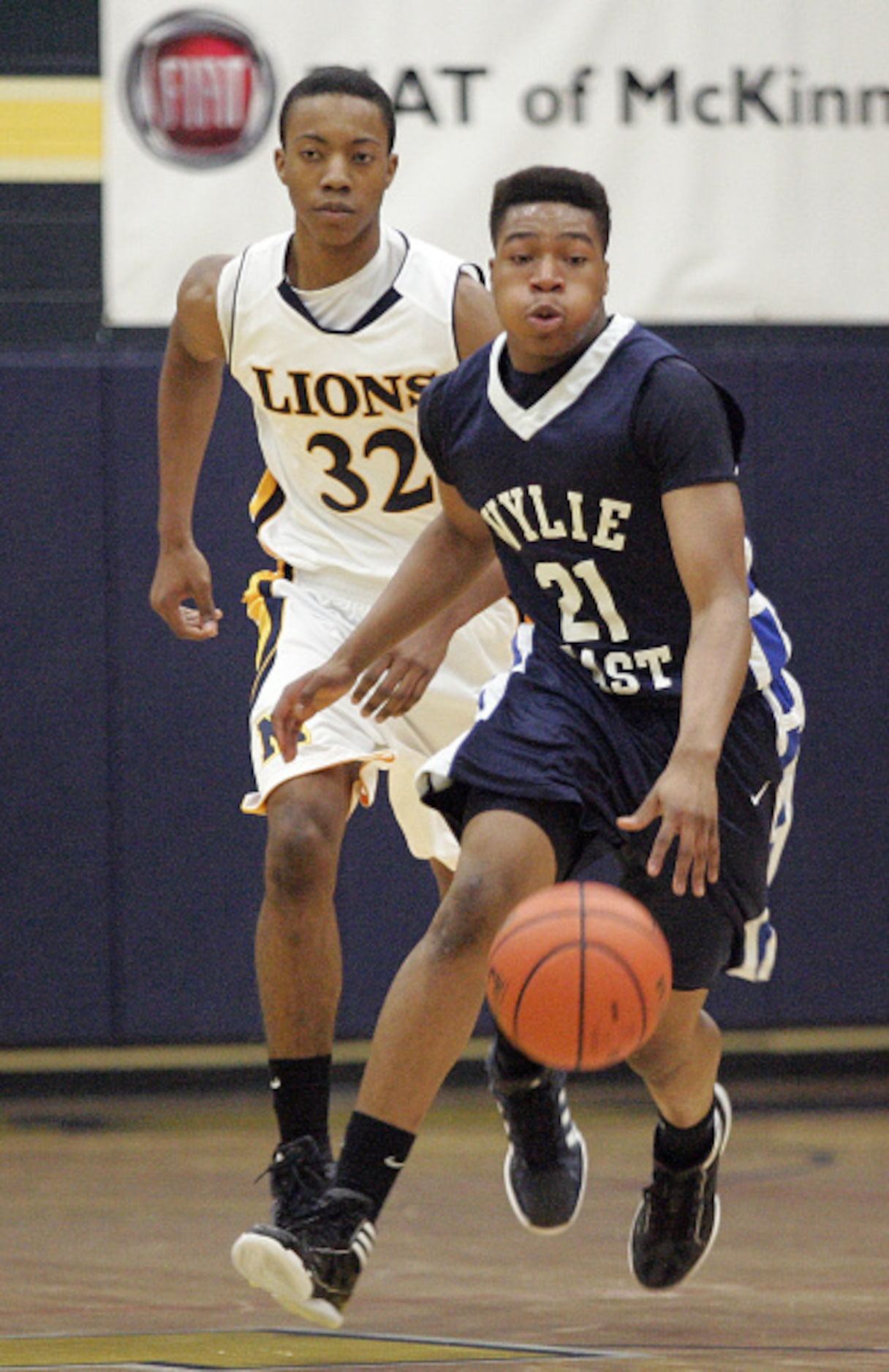 McKinney High School's Darrin Donaldson (32) trails Wylie East High School's  Jonny Oweyale...