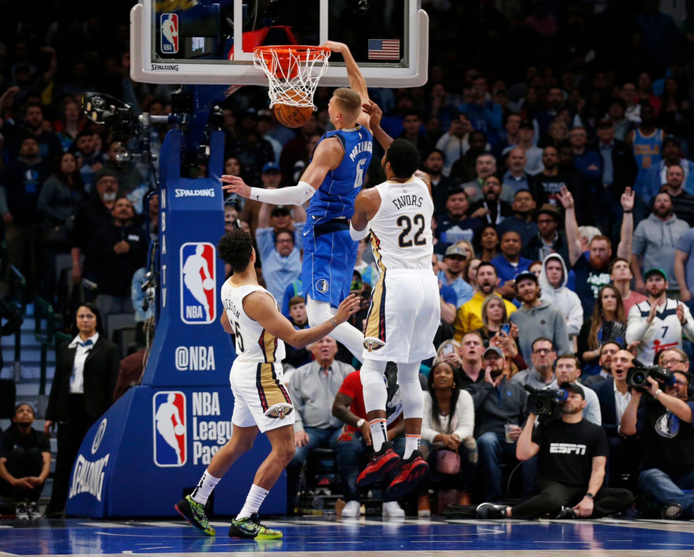 Dallas Mavericks forward Kristaps Porzingis (6) dunks the ball in between New Orleans...