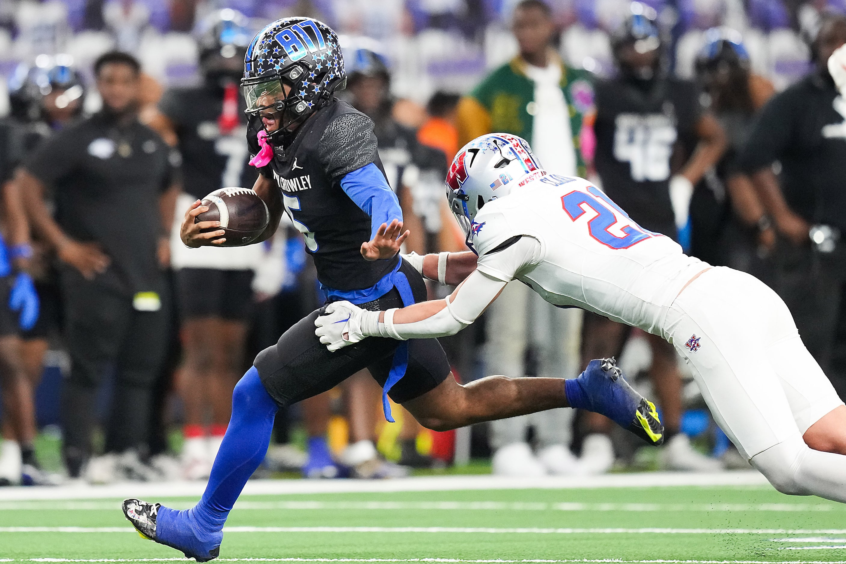 North Crowley running back Daniel Bray (5) gets past Austin Westlake defensive back Brandon...