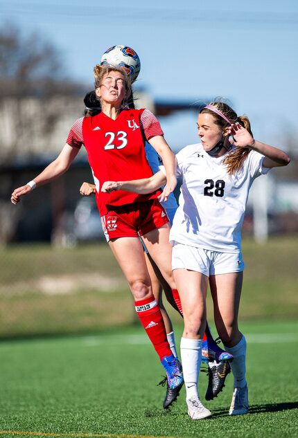 Ursuline’s Juliet Moore (23) receives the ball as she goes up against St. Agnes' Georgia...