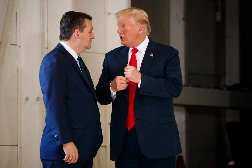 Sen. Ted Cruz talks with President Donald Trump before a meeting with families of the Santa...