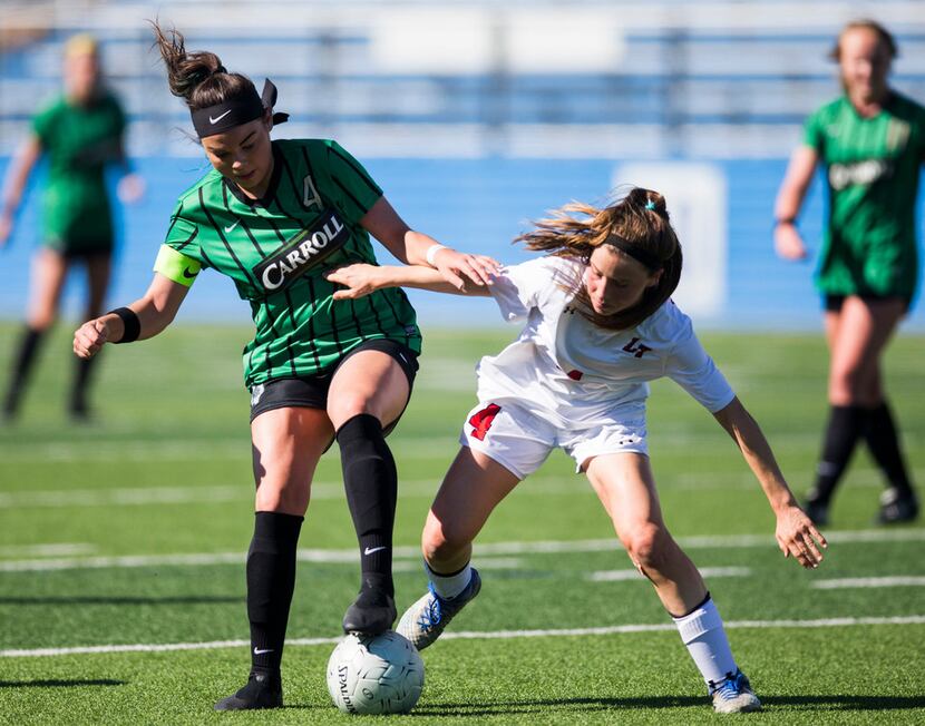 Southlake Carroll forward Taylor Tufts (4) takes the ball from Austin Lake Travis defender...