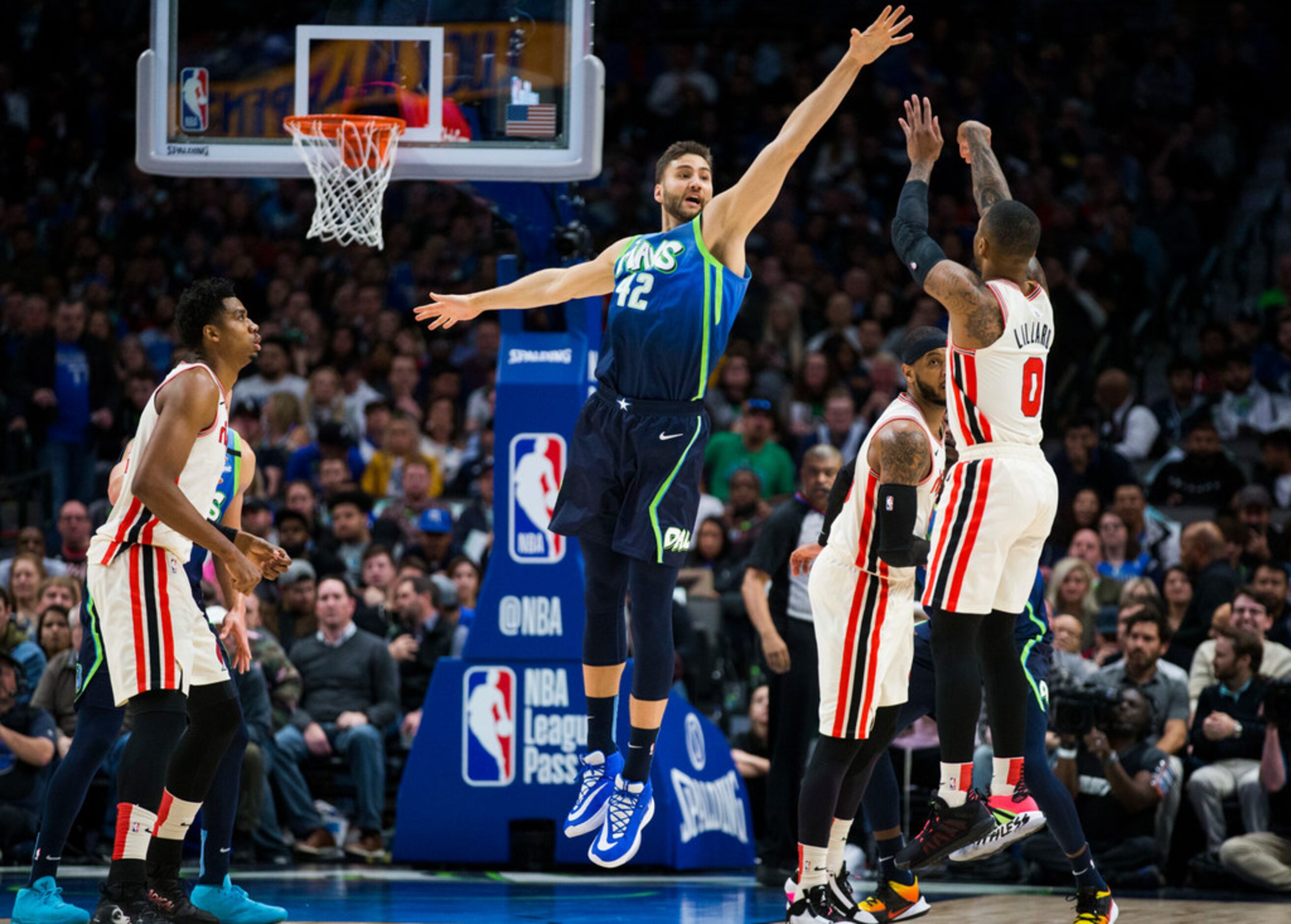 Dallas Mavericks forward Maxi Kleber (42) tries to block a shot by Portland Trail Blazers...