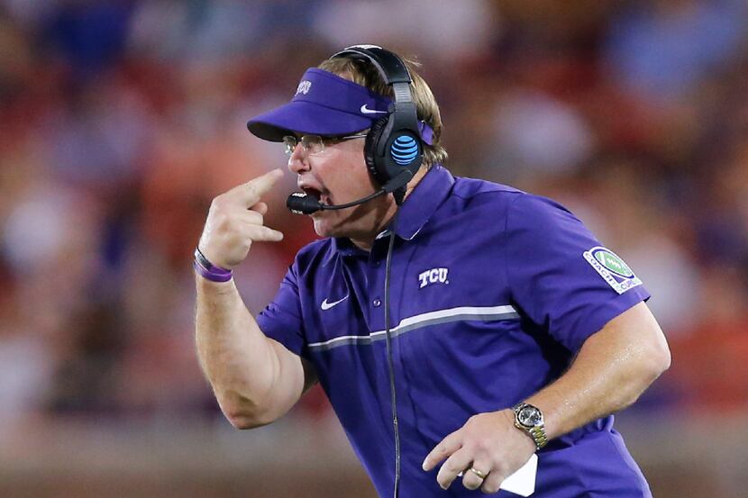 'Eyes on Me' - TCU Horned Frogs head coach Gary Patterson motions to his players during...