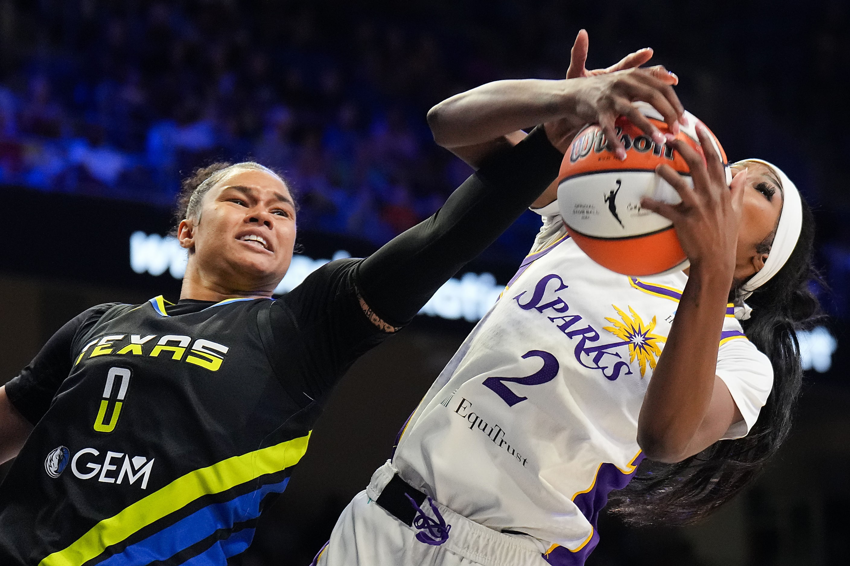 Dallas Wings forward Satou Sabally (0) fights for a rebound against Los Angeles Sparks...