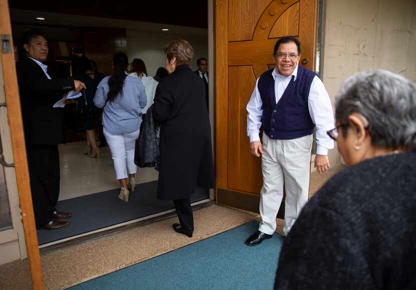 Juan Mejia (right) welcomed members of the First Mexican Baptist Church congregation into...