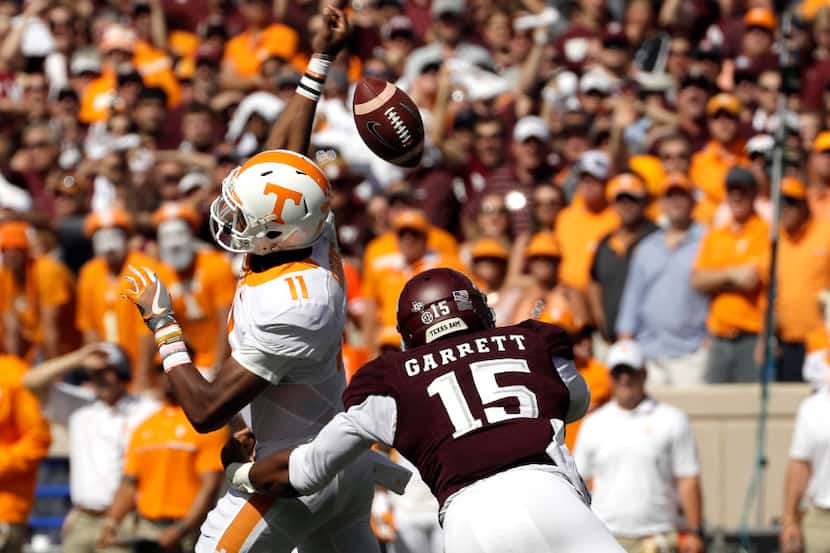FILE - In this Oct. 8, 2016, file photo, Tennessee quarterback Joshua Dobbs (11) loses the...
