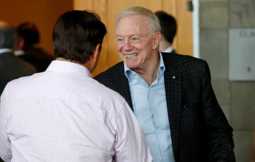 Dallas Cowboys owner Jerry Jones smiles as he is greeted as he arrives to attend a general...